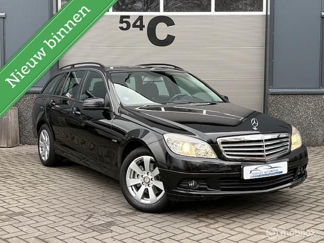 Zwart (metallic) Gebruikt 2010 Mercedes C180 Business Stationwagen | € 8.999 (Eerlijke prijs) - Afbeelding 1/4