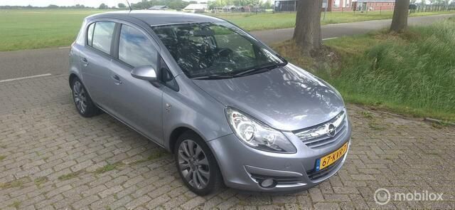 Grijs Gebruikt 2010 Opel Corsa Cosmo Hatchback | € 4.750 (Eerlijke prijs) - Afbeelding 1/4