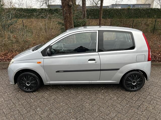 Occasion Daihatsu Cuore 58 PK (42 kW) 2008 Grijs (metallic) Hatchback