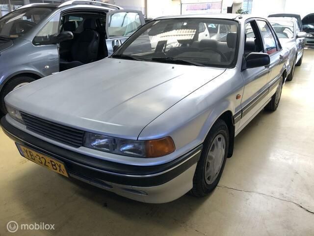 Grijs Gebruikt 1990 Mitsubishi Galant Sedan | € 1.850 - Afbeelding 1/4
