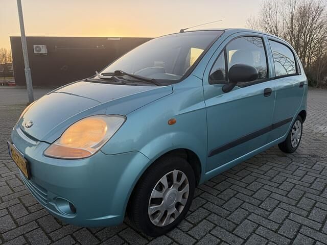 Blauw (metallic) Occasion 2006 Chevrolet Matiz Hatchback | € 999 (Goede deal) - Afbeelding 1/4