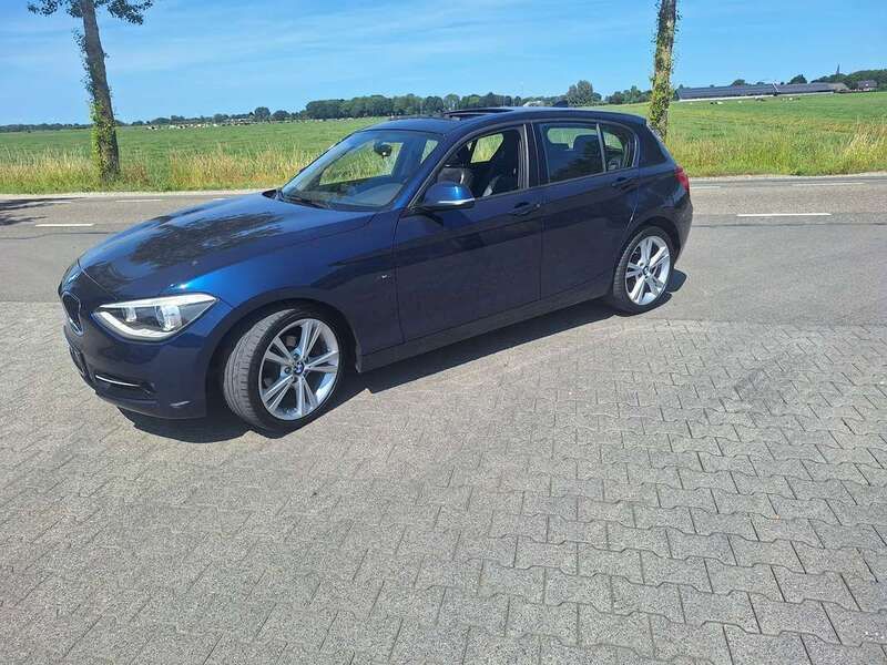 Blauw, metallic lak Gebruikt 2014 BMW 116 Sport Line Hatchback | € 12.650 (Iets duurder) - Afbeelding 1/4