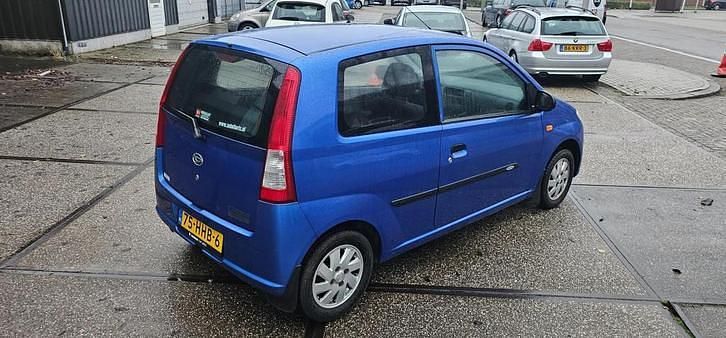 Occasion Daihatsu Cuore 59 PK (43 kW) 2008 Blauw Hatchback