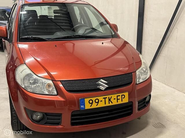 Oranje Gebruikt 2006 Suzuki SX4 Exclusive MPV | € 6.499 (Iets duurder) - Afbeelding 1/4