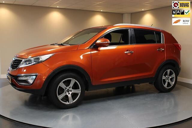 Oranje (metallic) Gebruikt 2012 Kia Sportage Plus SUV | € 9.940 (Goede deal) - Afbeelding 1/4