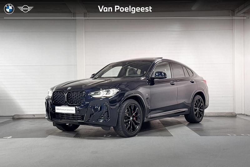 M carbonschwarz (donker zwart) Gebruikt 2024 BMW X4 Comfort Edition SUV | € 64.900 (Eerlijke prijs) - Afbeelding 1/4