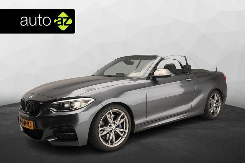 Grijs, metallic lak Gebruikt 2015 BMW M235 Executive Cabriolet | € 27.900 (Eerlijke prijs) - Afbeelding 1/4