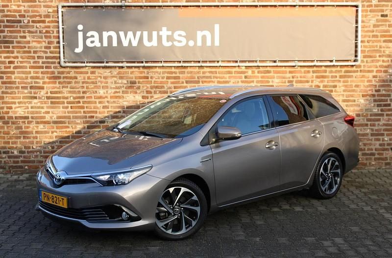 Bruin (metallic) Gebruikt 2015 Toyota Auris Touring Sports Stationwagen | € 17.950 (Duur) - Afbeelding 1/4