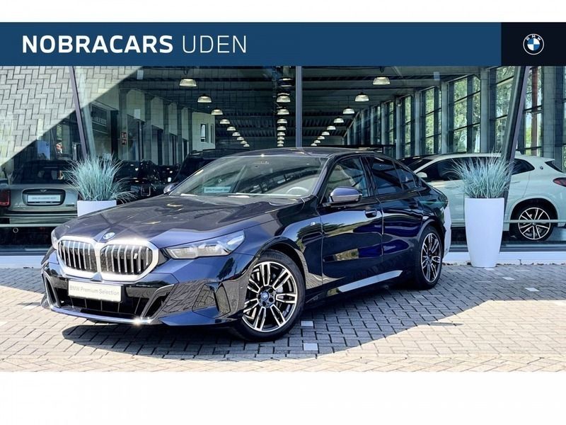 M carbonschwarz Gebruikt 2024 BMW i5 Executive Sedan | € 59.950 - Afbeelding 1/4