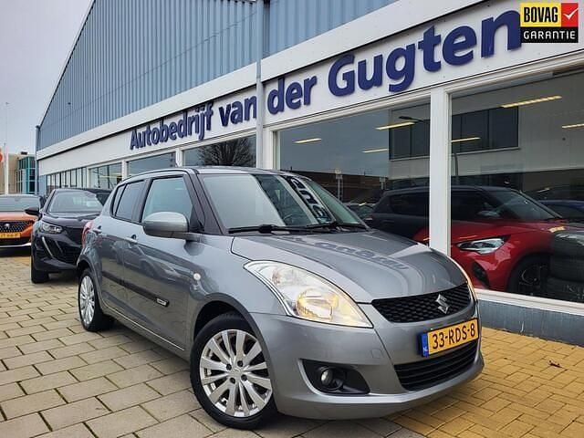 Grijs Gebruikt 2011 Suzuki Swift Exclusive Hatchback | € 6.950 (Eerlijke prijs) - Afbeelding 1/4