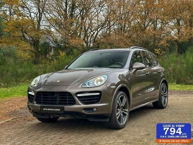 Bruin (metallic) Gebruikt 2011 Porsche Cayenne Turbo SUV | € 59.950 (Eerlijke prijs) - Afbeelding 1/4
