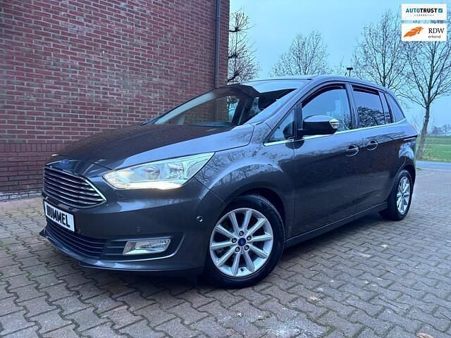 Grijs (metallic) Gebruikt 2017 Ford Grand C-Max Titanium MPV | € 10.899 - Afbeelding 1/4