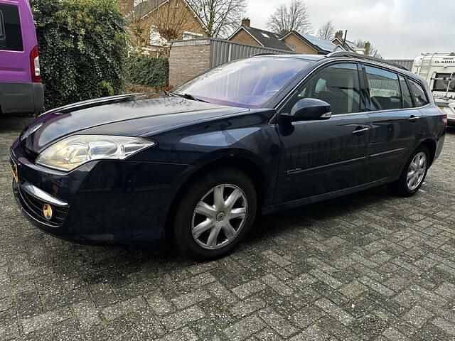 Blauw (metallic) Gebruikt 2009 Renault Laguna III Stationwagen | € 900 - Afbeelding 1/4