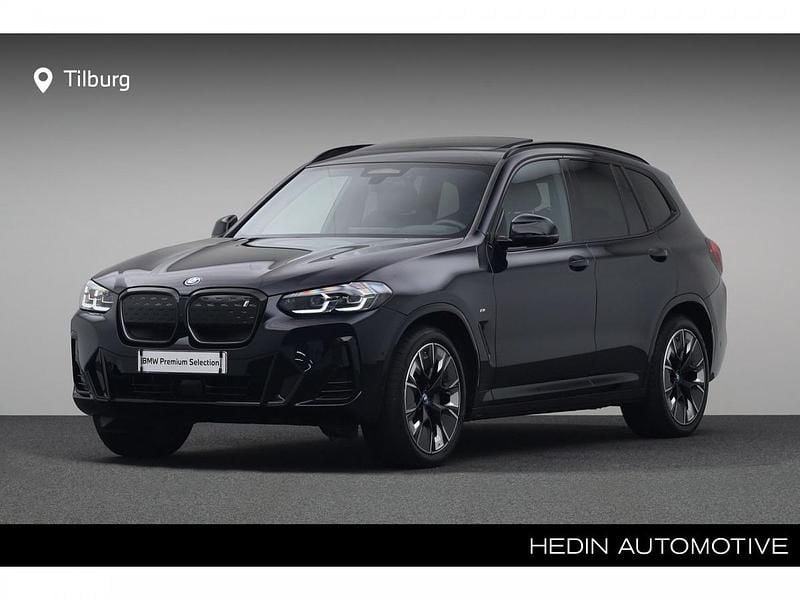 M carbonschwarz metallic (donker zwart metallic) Gebruikt 2024 BMW iX3 Comfort Edition SUV | € 53.880 (Goede deal) - Afbeelding 1/4