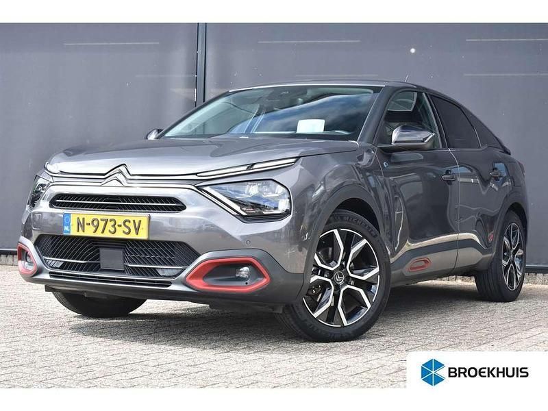 Grijs, metallic lak Gebruikt 2021 Citroën e-C4 Shine SUV | € 14.900 (Goede deal) - Afbeelding 1/4