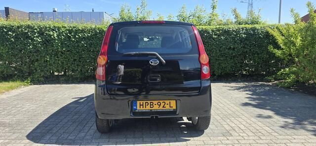 Occasion Daihatsu Cuore 69 PK (50 kW) 2009 Zwart Hatchback