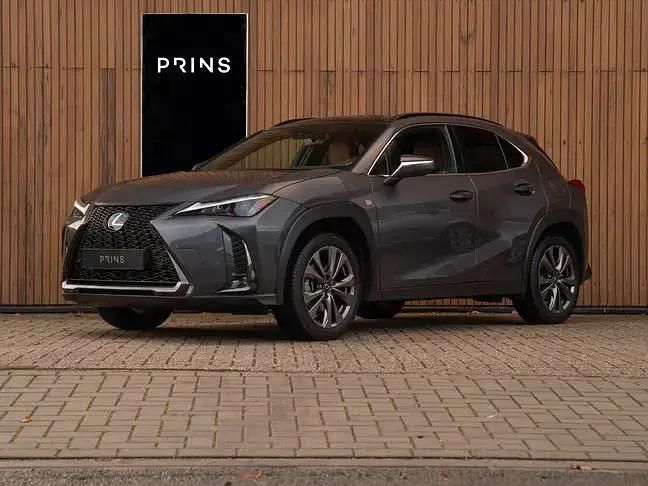 Grijs Gebruikt 2023 Lexus UX 250h Sport Design Packet SUV | € 34.900 (Super prijs) - Afbeelding 1/4