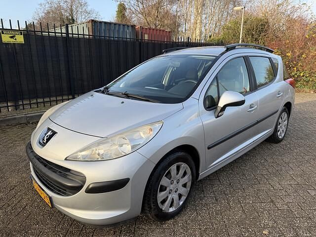 Grijs (metallic) Gebruikt 2009 Peugeot 207 Stationwagen | € 950 (Eerlijke prijs) - Afbeelding 1/4