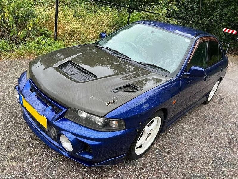 Blauw Gebruikt 1996 Mitsubishi Lancer Sedan | € 8.200 - Afbeelding 1/4