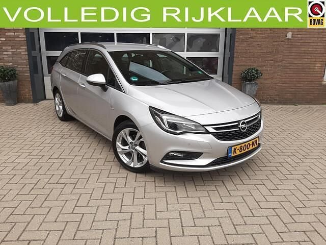 Grijs, metallic lak Gebruikt 2016 Opel Astra Innovation Stationwagen | € 9.500 (Eerlijke prijs) - Afbeelding 1/4