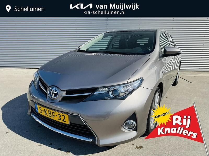 Bruin Gebruikt 2013 Toyota Auris Hybrid Hatchback | € 11.350 (Eerlijke prijs) - Afbeelding 1/4