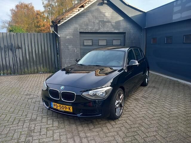 Zwart Gebruikt 2012 BMW 116 Hatchback | € 6.999 (Goede deal) - Afbeelding 1/4