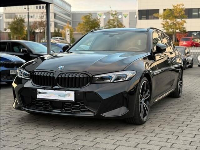 Zwart (metallic) Gebruikt 2024 BMW 320 M Sport Stationwagen | € 59.900 - Afbeelding 1/4