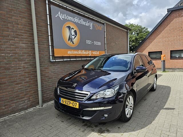 Blauw, metallic lak Gebruikt 2014 Peugeot 308 Stationwagen | € 3.445 (Eerlijke prijs) - Afbeelding 1/4