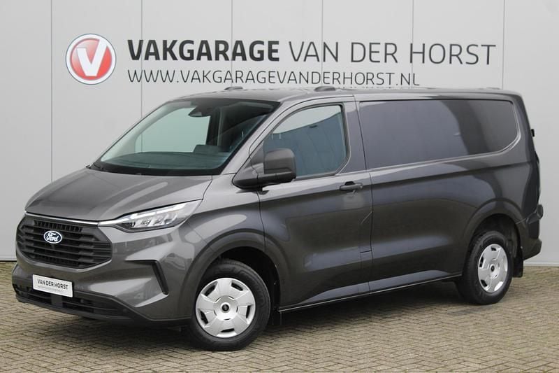 Grijs (metallic) Gebruikt 2024 Ford Transit Custom Trend Van | € 26.750 (Super prijs) - Afbeelding 1/3