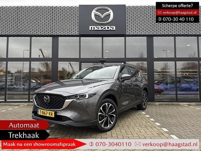Machine gray metallic (46g) Gebruikt 2023 Mazda CX-5 Exclusive-Line SUV | € 36.940 (Eerlijke prijs) - Afbeelding 1/4