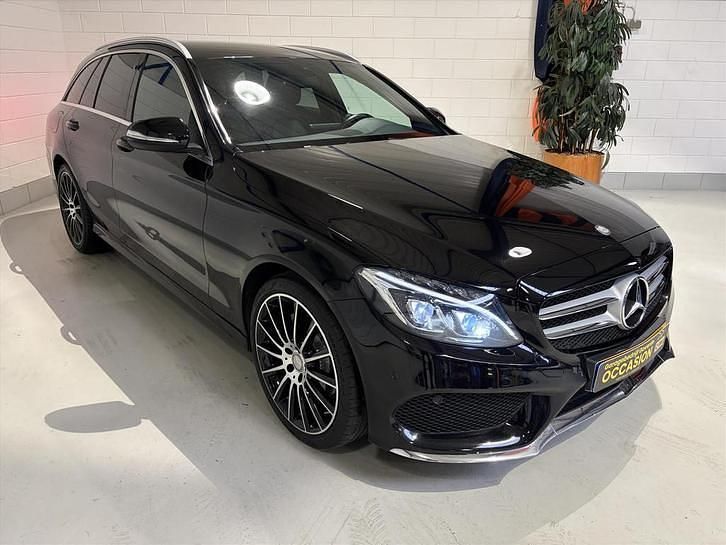 Zwart (metallic) Occasion 2014 Mercedes C180 AMG line Stationwagen | € 14.850 (Eerlijke prijs) - Afbeelding 1/4