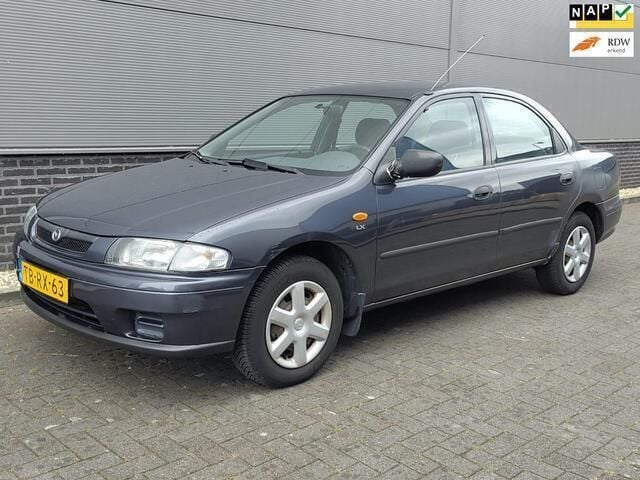 Blauw Gebruikt 1998 Mazda 323 Sedan | € 700 (Goede deal) - Afbeelding 1/4