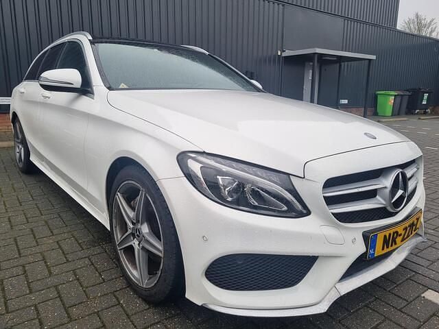 Wit (metallic) Occasion 2017 Mercedes C180 Sport Edition Stationwagen | € 19.749 (Eerlijke prijs) - Afbeelding 1/4