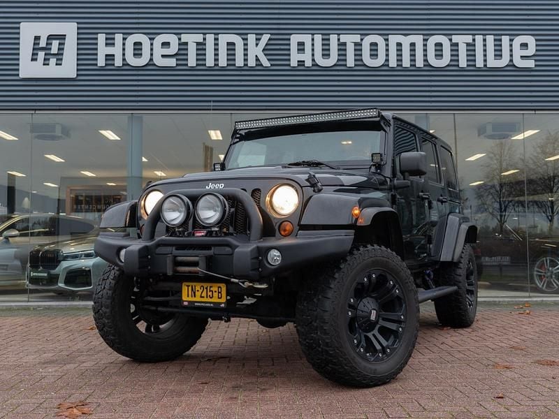 Zwart Gebruikt 2012 Jeep Wrangler Sahara SUV | € 37.940 (Eerlijke prijs) - Afbeelding 1/4