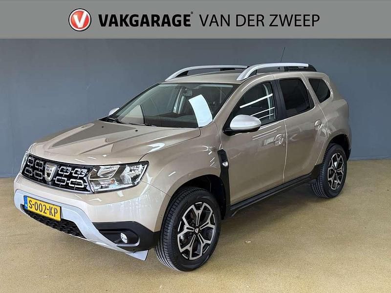 Bruin Gebruikt 2021 Dacia Duster Prestige SUV | € 16.950 (Eerlijke prijs) - Afbeelding 1/4