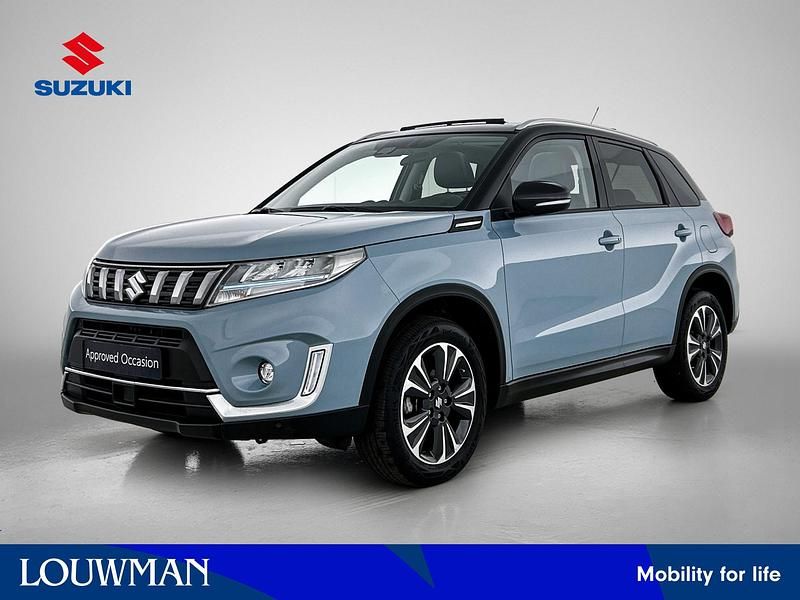 Blauw metallic Gebruikt 2024 Suzuki Vitara Style SUV | € 28.950 (Eerlijke prijs) - Afbeelding 1/4