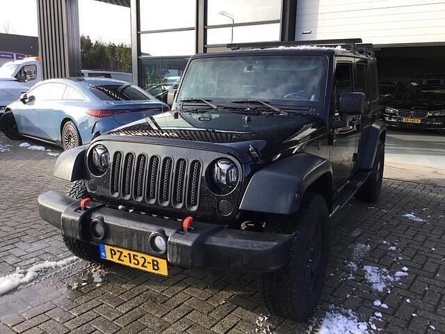 Zwart Occasion 2014 Jeep Wrangler Unlimited Sahara SUV | € 28.500 - Afbeelding 1/4