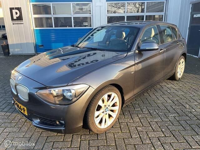 Grijs Gebruikt 2012 BMW 116 Urban Line Hatchback | € 5.950 (Goede deal) - Afbeelding 1/4