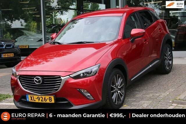 Rood, metallic lak Gebruikt 2016 Mazda CX-3 SUV | € 15.295 (Eerlijke prijs) - Afbeelding 1/4
