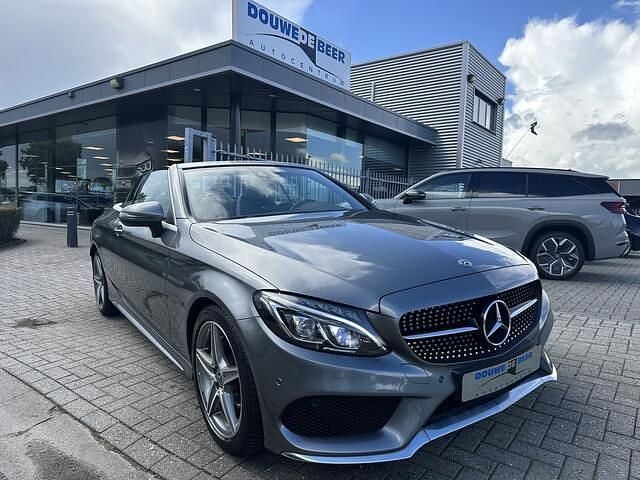 Grijs Gebruikt 2018 Mercedes C180 AMG line Cabriolet | € 29.900 (Eerlijke prijs) - Afbeelding 1/4