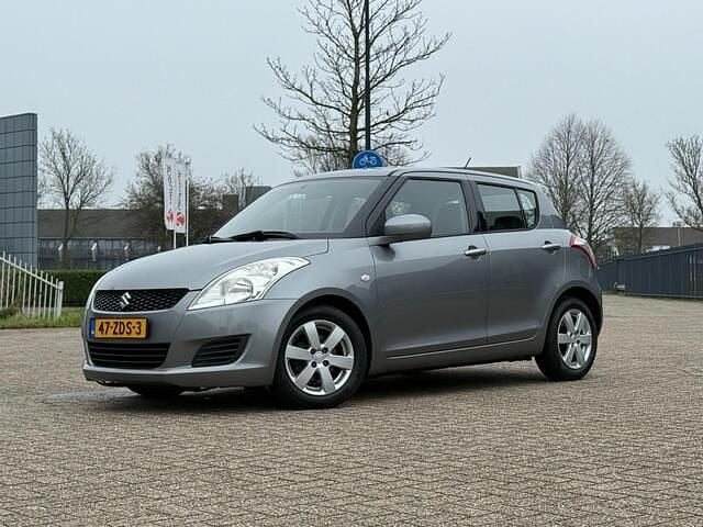 Grijs Gebruikt 2012 Suzuki Swift Comfort Hatchback | € 5.750 (Goede deal) - Afbeelding 1/4