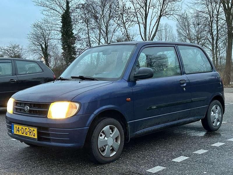 Occasion Daihatsu Cuore 56 PK (41 kW) 1999 Blauw Hatchback