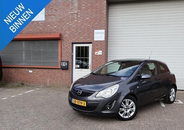 Grijs Gebruikt 2012 Opel Corsa Business Edition Hatchback | € 1.299 (Goede deal) - Afbeelding 1/4