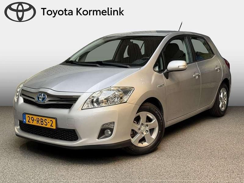 Grijs, metallic lak Gebruikt 2011 Toyota Auris Hybrid Hatchback | € 11.950 (Goede deal) - Afbeelding 1/4