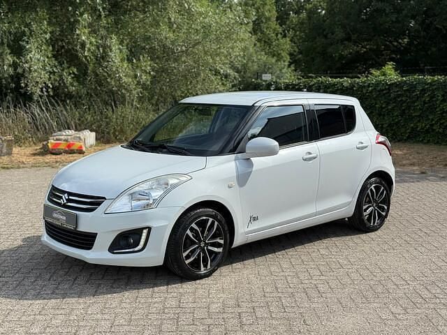 , metallic lak Gebruikt 2015 Suzuki Swift Exclusive Hatchback | € 8.250 (Eerlijke prijs) - Afbeelding 1/4