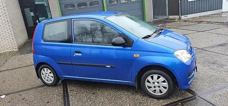 Occasion Daihatsu Cuore 59 PK (43 kW) 2008 Blauw Hatchback