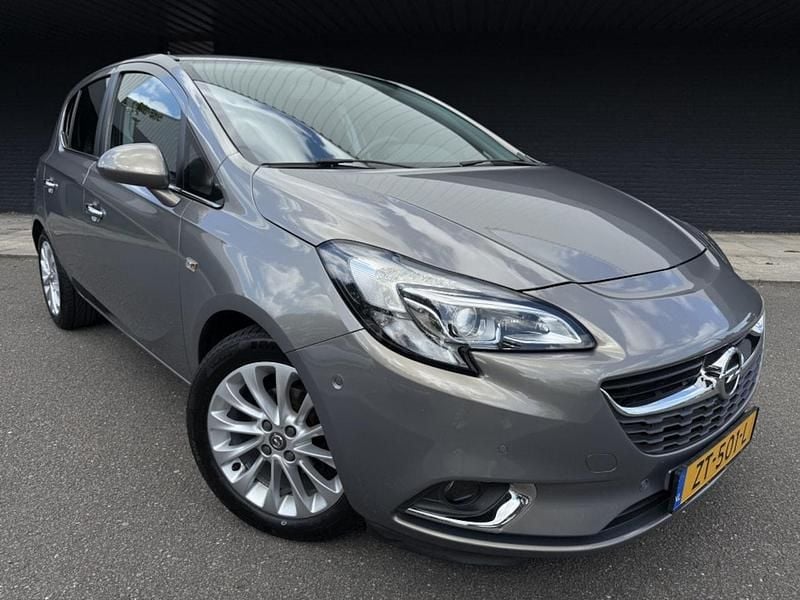 Bruin Occasion 2015 Opel Corsa Cosmo Hatchback | € 7.995 (Eerlijke prijs) - Afbeelding 1/4
