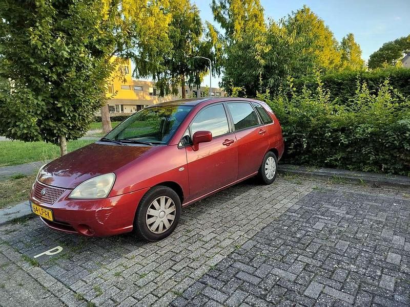 Rood Gebruikt 2003 Suzuki Liana GLX Stationwagen | € 650 - Afbeelding 1/4