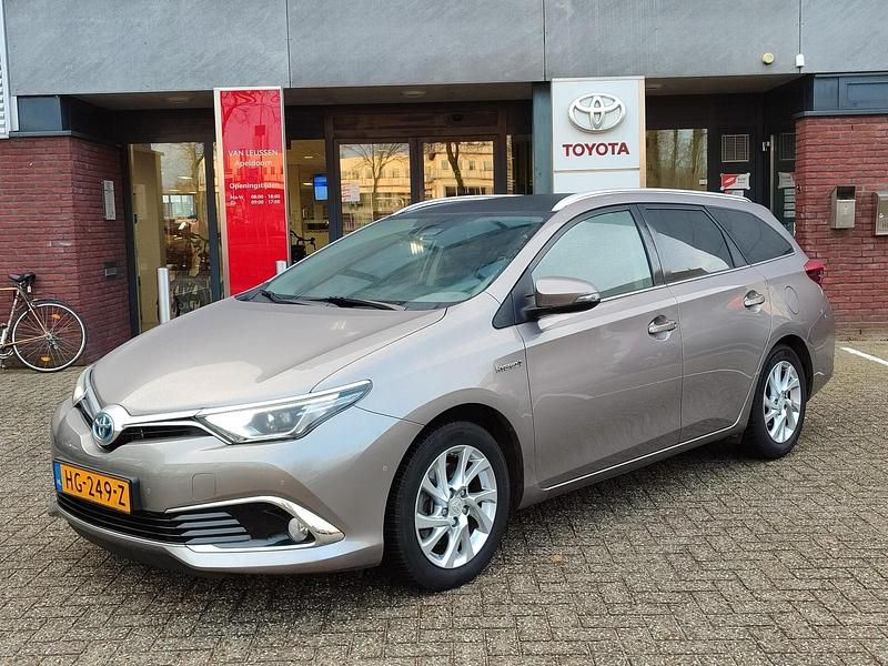 Bruin Occasion 2015 Toyota Auris Touring Sports Stationwagen | € 14.400 (Eerlijke prijs) - Afbeelding 1/4