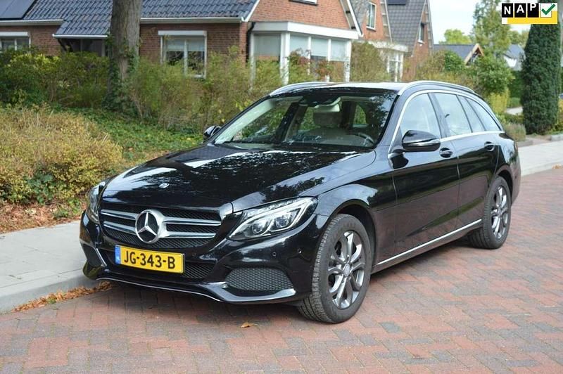 Zwart Gebruikt 2016 Mercedes C180 Prestige Stationwagen | € 13.995 (Goede deal) - Afbeelding 1/4
